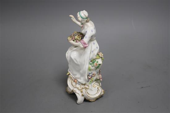 A Chelsea figure of a lady holding a flower basket, c.1765, H. 17.5cm